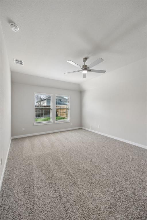 1456 Companero Street Haslet, TX 76052 - Photo 17 of 33 a view of an empty room with a window