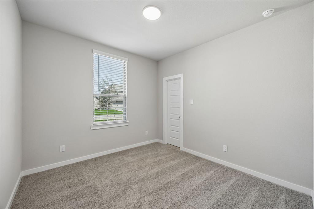 1456 Companero Street Haslet, TX 76052 - Photo 21 of 33 an empty room with windows and closet