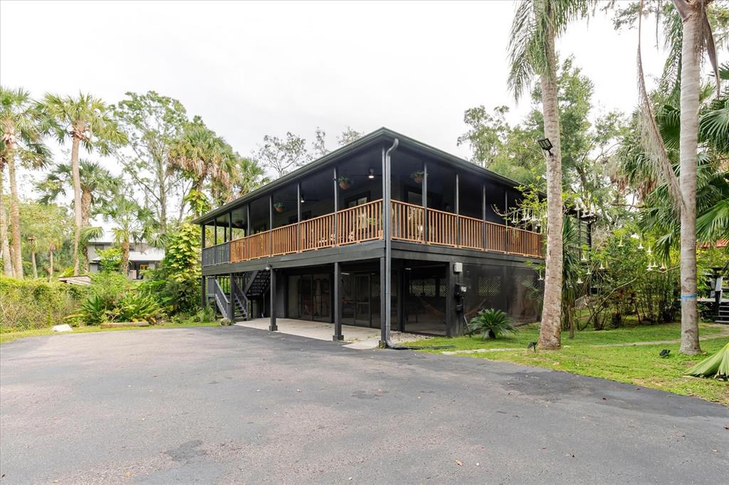 8304 Revels Road Riverview, FL 33569 - Photo 2 of 99 a front view of a house with a garden