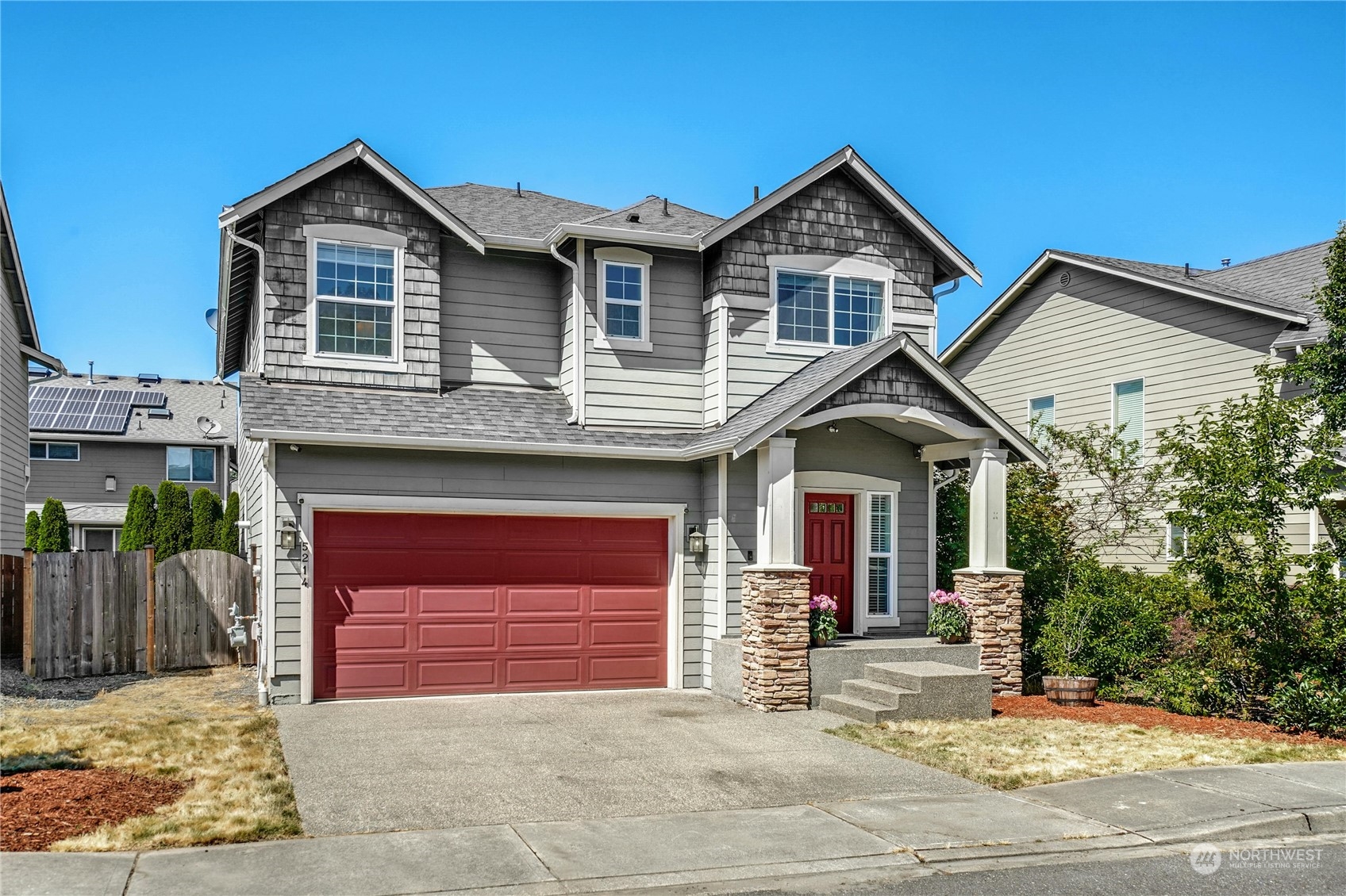 5214 Northeast 7th Street Renton, WA 98059 - Photo 1 of 20 a front view of a house with a yard