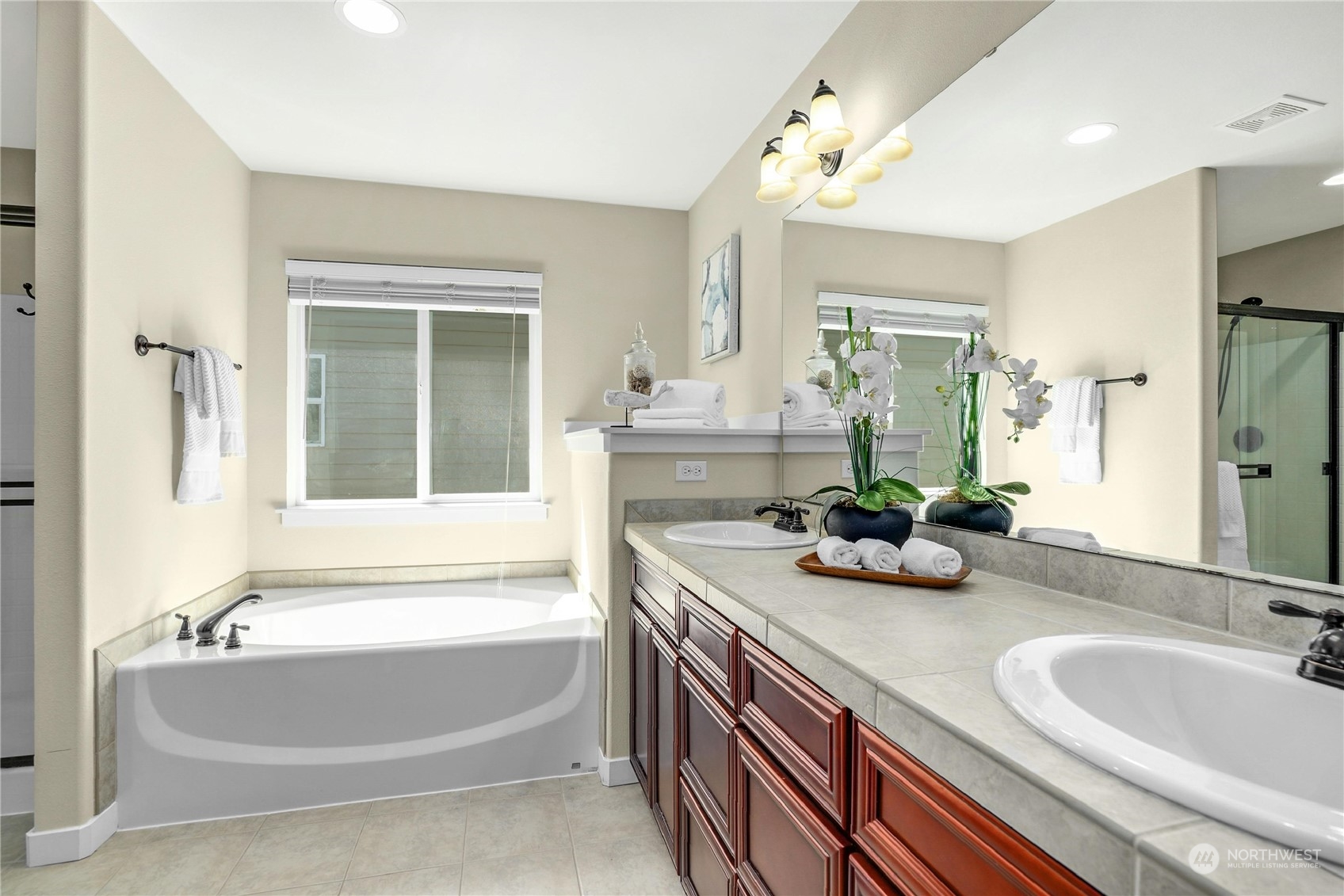 5214 Northeast 7th Street Renton, WA 98059 - Photo 11 of 20 a bathroom with a tub sink and mirror