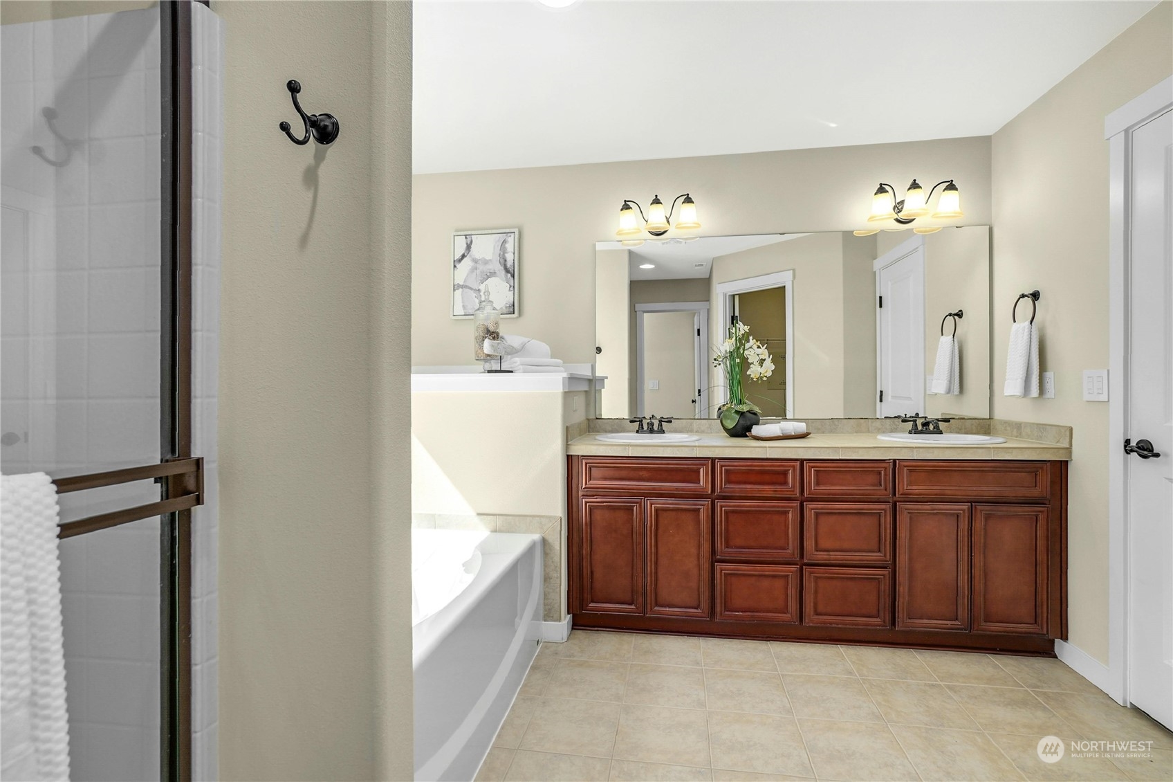 5214 Northeast 7th Street Renton, WA 98059 - Photo 12 of 20 a spacious bathroom with a granite countertop sink mirror and a bathtub