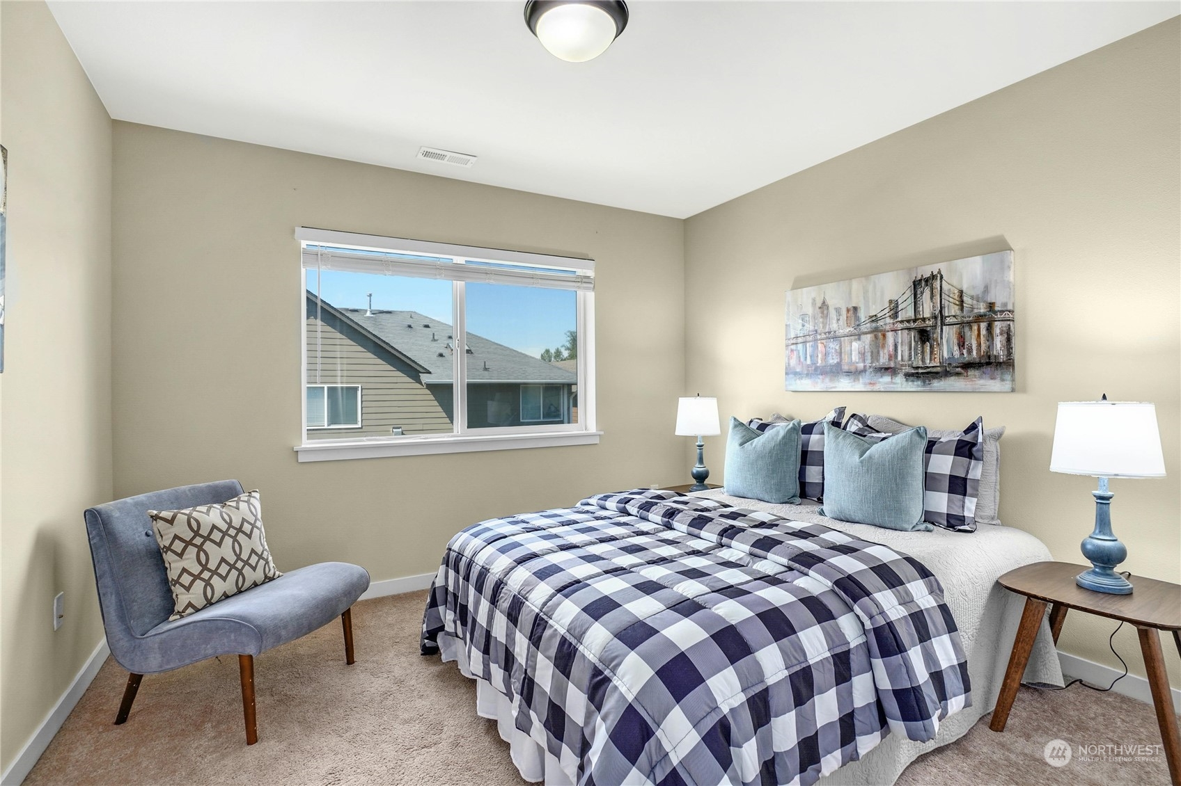 5214 Northeast 7th Street Renton, WA 98059 - Photo 14 of 20 a bedroom with a bed and chair