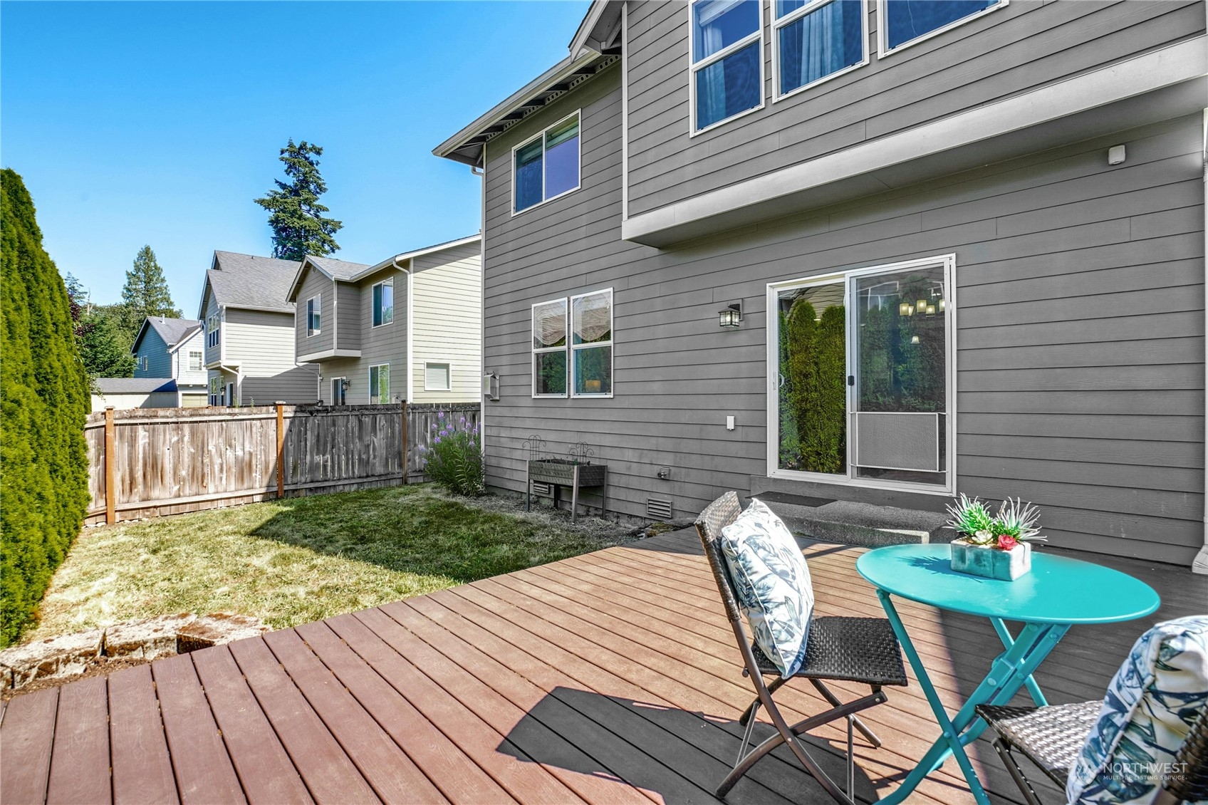 5214 Northeast 7th Street Renton, WA 98059 - Photo 19 of 20 a backyard of a house with table and chairs