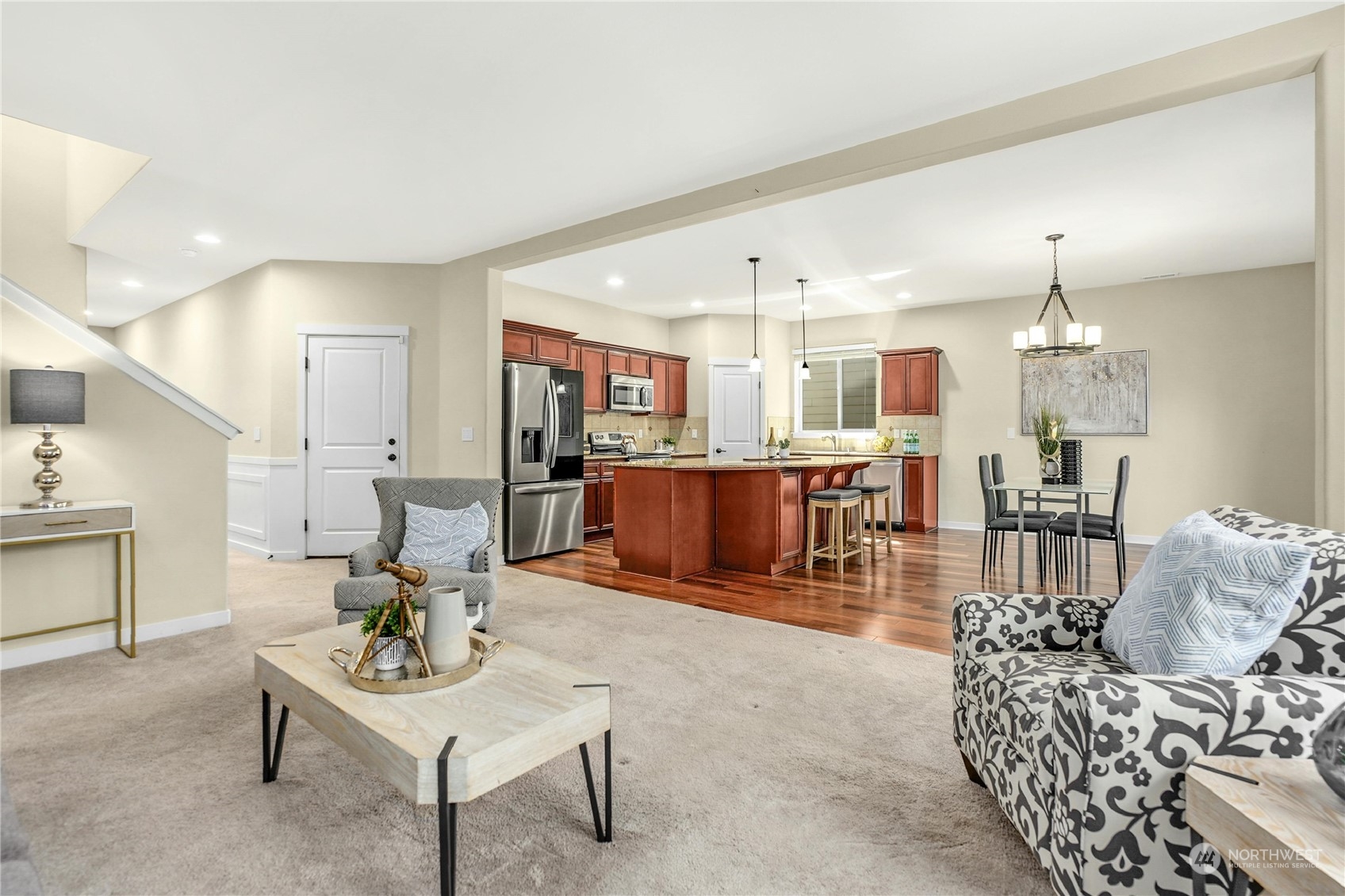 5214 Northeast 7th Street Renton, WA 98059 - Photo 5 of 20 a living room with furniture kitchen view and a chandelier