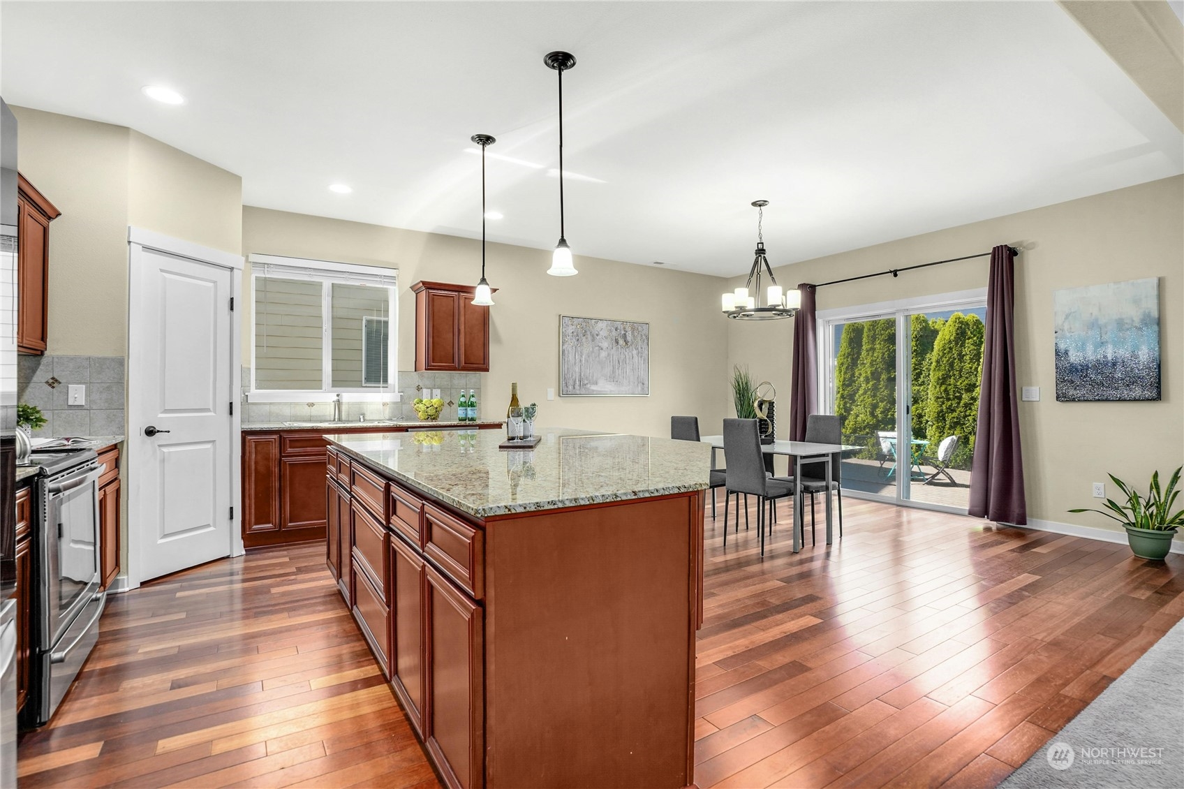5214 Northeast 7th Street Renton, WA 98059 - Photo 7 of 20 a kitchen with center island table and chairs