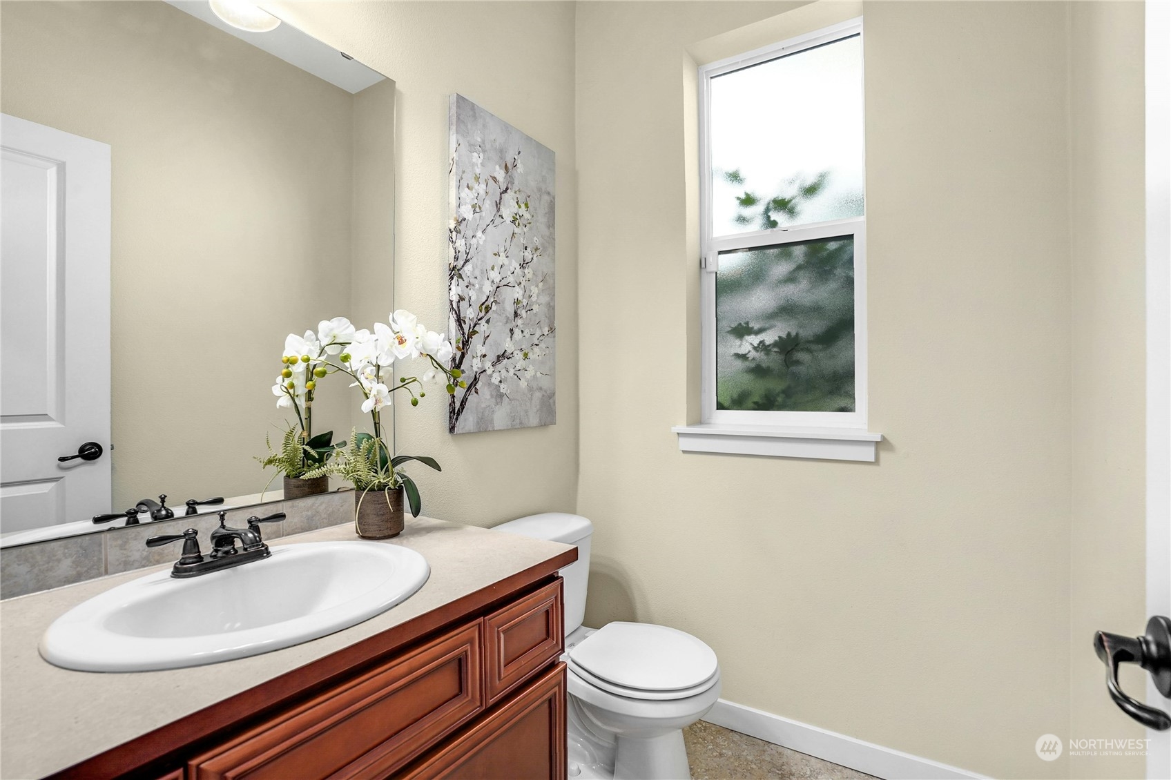 5214 Northeast 7th Street Renton, WA 98059 - Photo 8 of 20 a bathroom with a sink toilet and a mirror