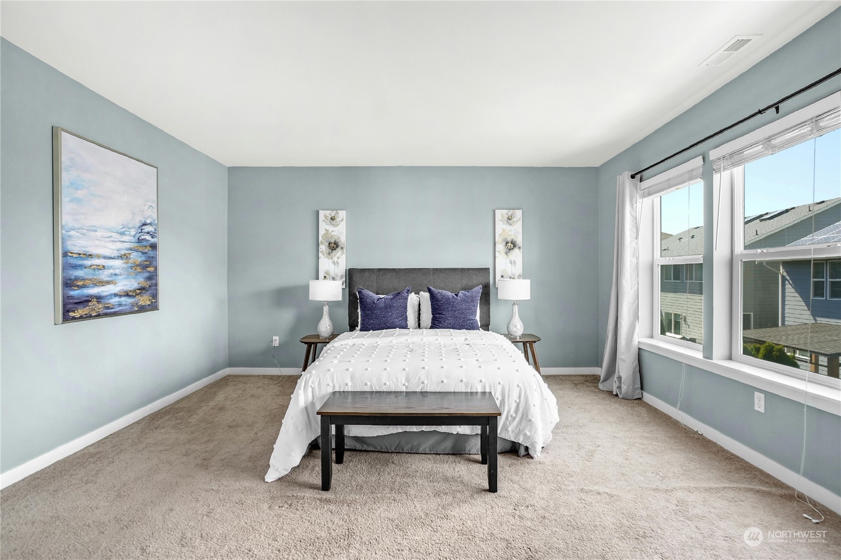 5214 Northeast 7th Street Renton, WA 98059 - Photo 10 of 20 a bed sitting in a bedroom next to a window