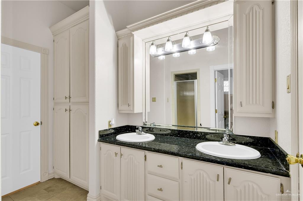 3517 Princess Street Edinburg, TX 78539 - Photo 19 of 22 a bathroom with double vanity sinks and a mirror