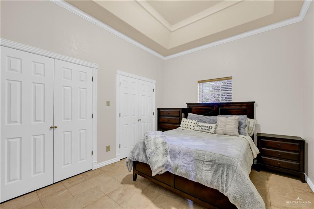 3517 Princess Street Edinburg, TX 78539 - Photo 20 of 22 a bedroom with a bed and a ceiling fan