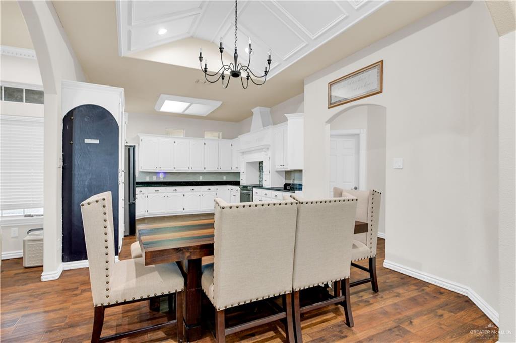 3517 Princess Street Edinburg, TX 78539 - Photo 8 of 22 a view of a dining room with furniture and wooden floor