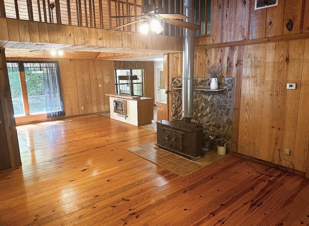 210 Whispering Pines Trail Minden, LA 71055 - Photo 3 of 16 Featuring a beautifully rustic wood stove