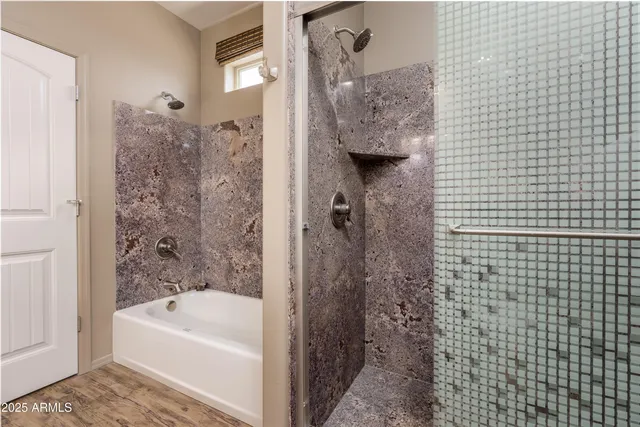 a bathroom with a granite countertop sink a toilet and a mirror