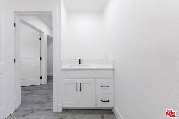 a bathroom with a sink and mirror