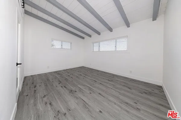an empty room with wooden floor