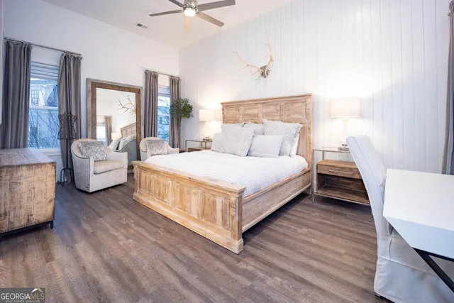 a bedroom with a bed and a couch