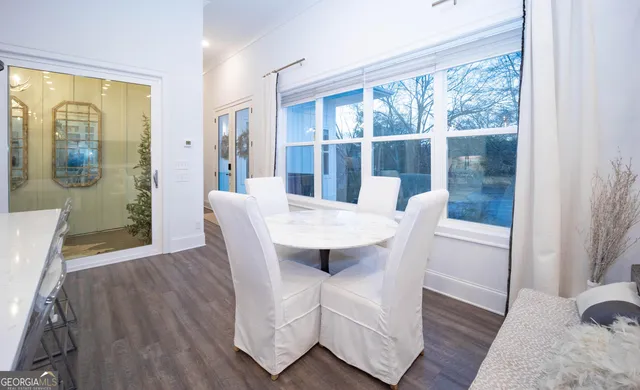 a view of a dining room with furniture window and wooden floor