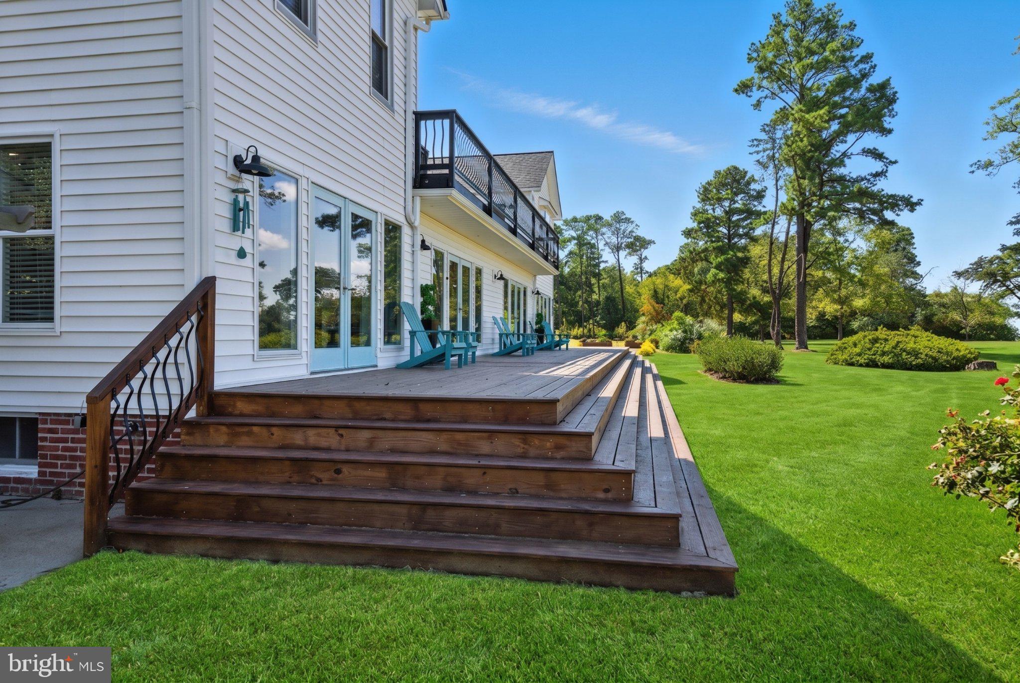 522 Felton Road Deltaville, VA 23043 - Photo 4 of 48 Spacious deck overlooking lush greenery.
