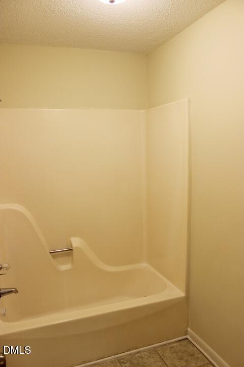 203 East Ransom Street, Unit 3D Fuquay-Varina, NC 27526 - Photo 7 of 10 a bathroom with a shower