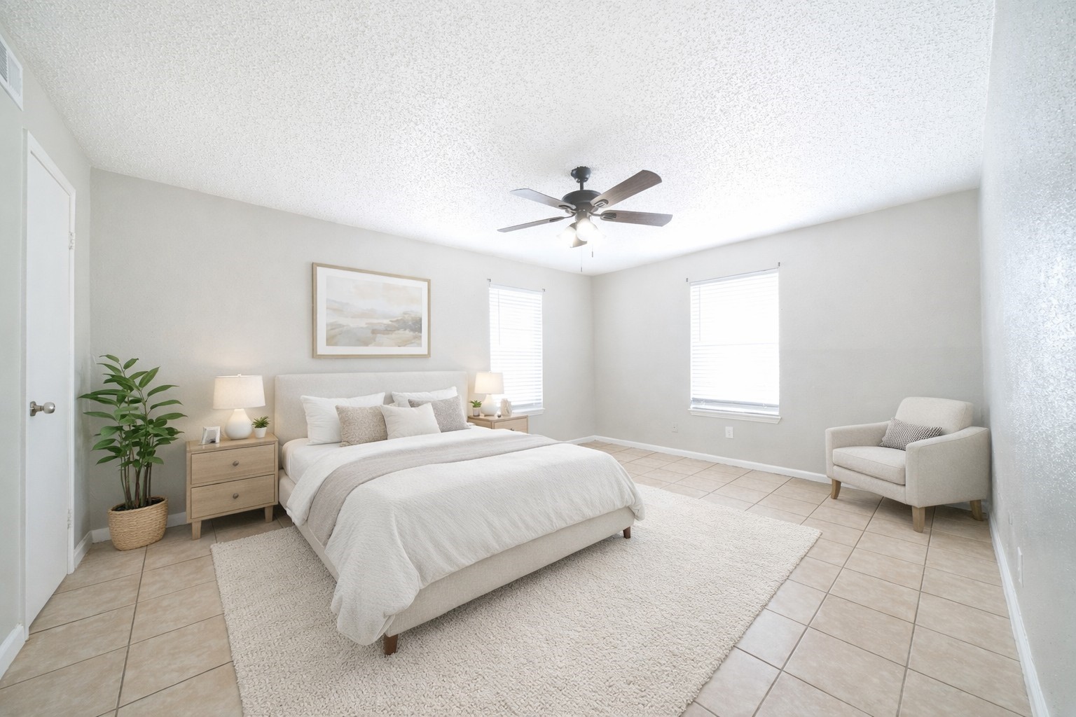 8100 Leonora Street, Unit F4 Houston, TX 77061 - Photo 6 of 11 a bedroom with a bed and a chandelier