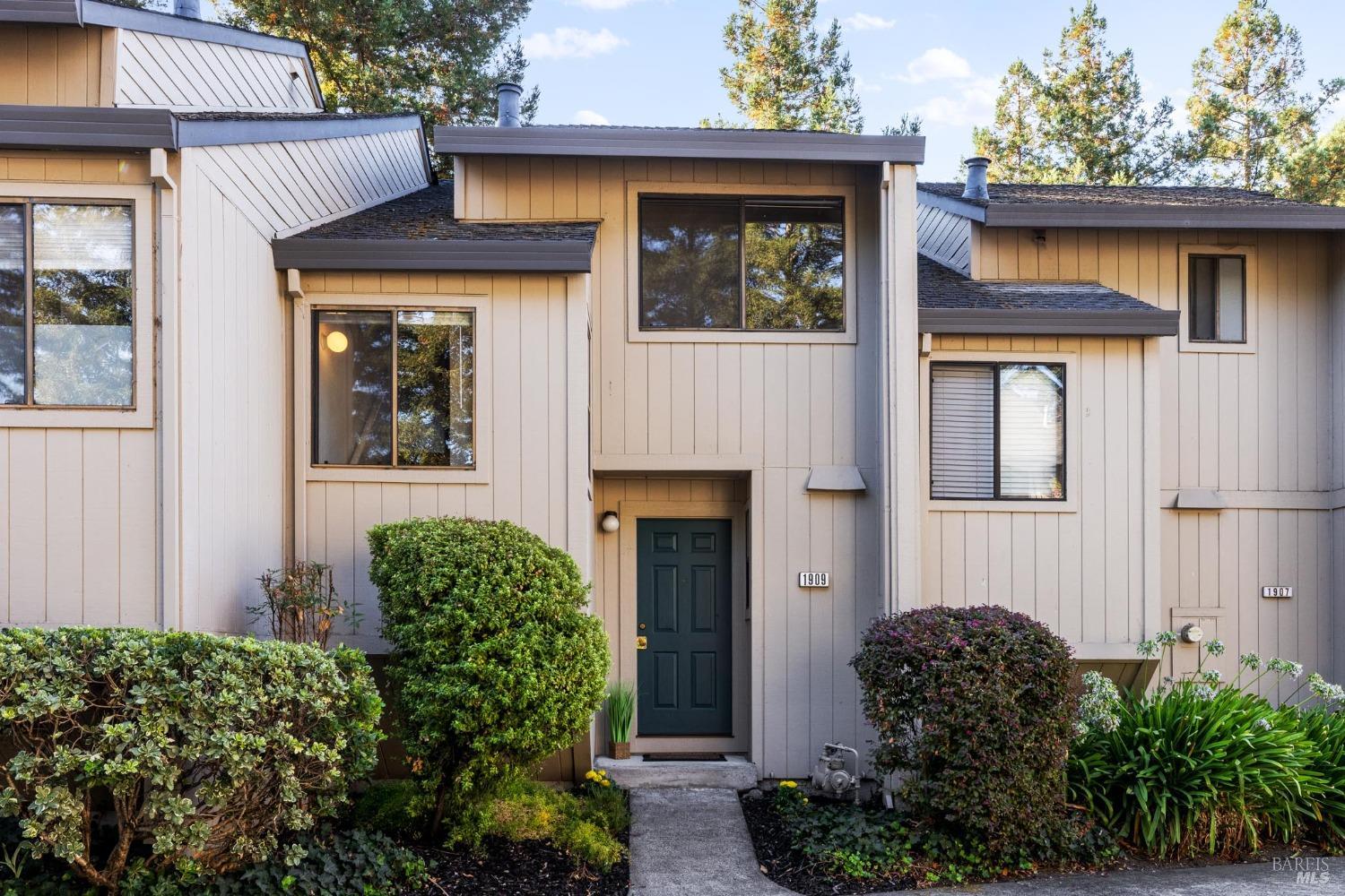 a front view of a house with garden