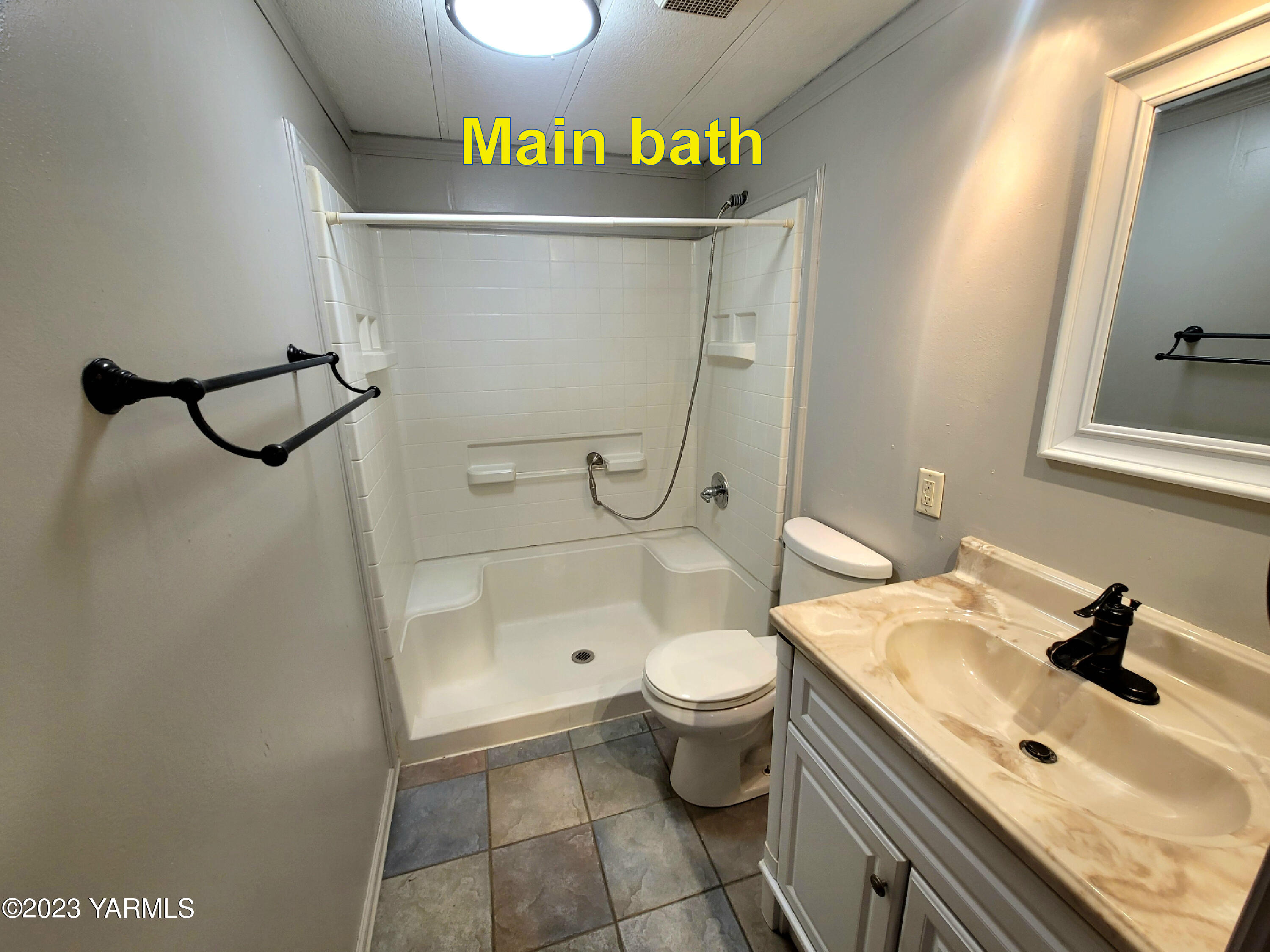 3005 Castlevale Road, Unit 50 Yakima, WA 98902 - Photo 13 of 16 a bathroom with a granite countertop sink toilet and shower