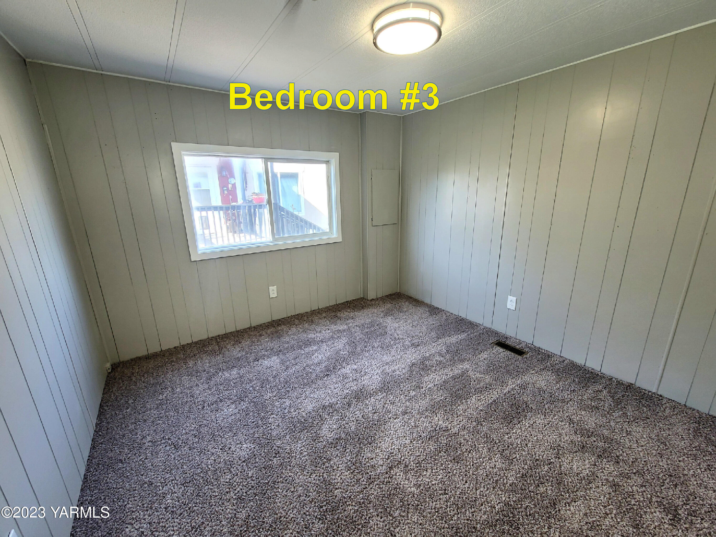 3005 Castlevale Road, Unit 50 Yakima, WA 98902 - Photo 14 of 16 a view of an empty room with a window