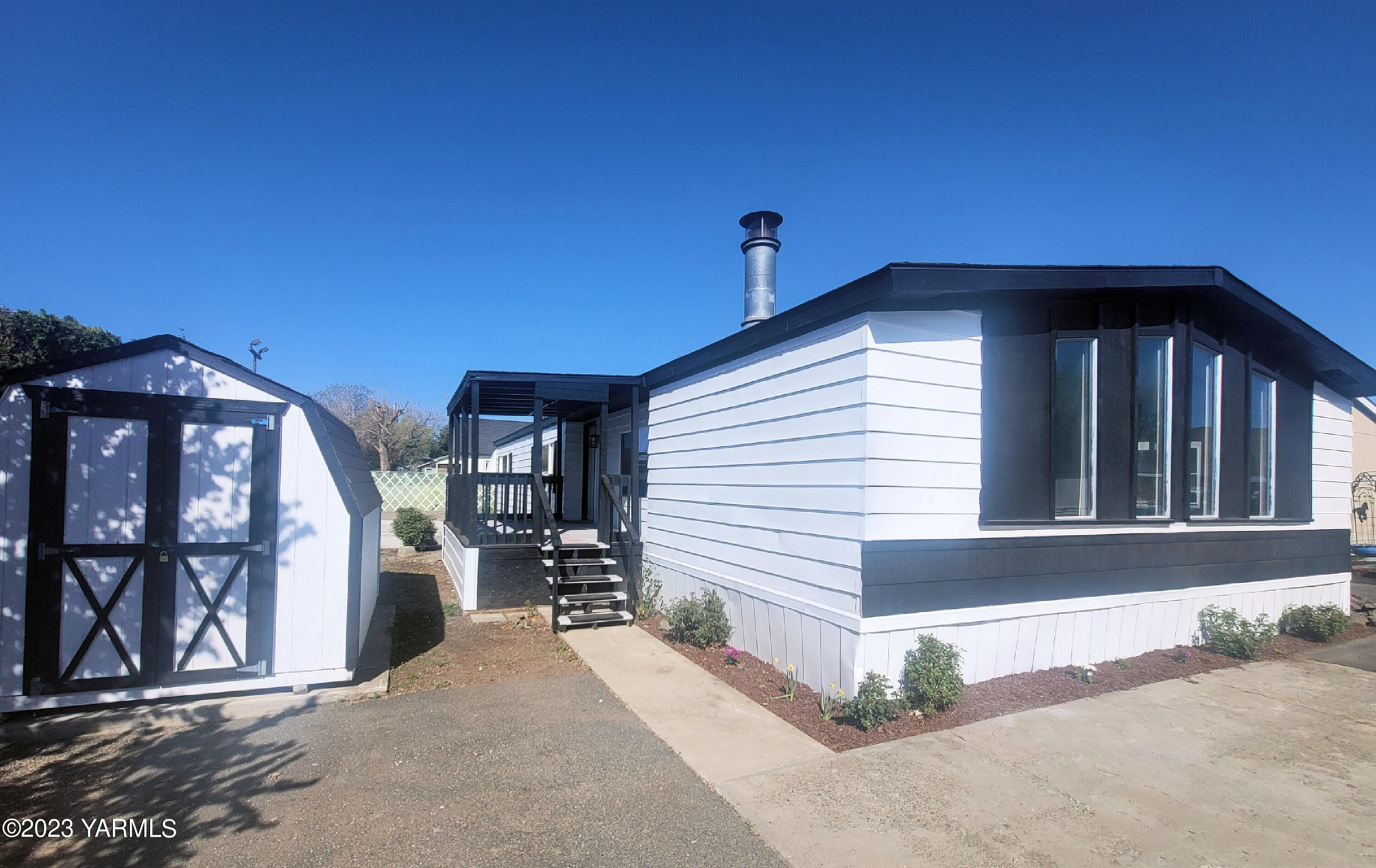 3005 Castlevale Road, Unit 50 Yakima, WA 98902 - Photo 16 of 16 a view of a house with a porch