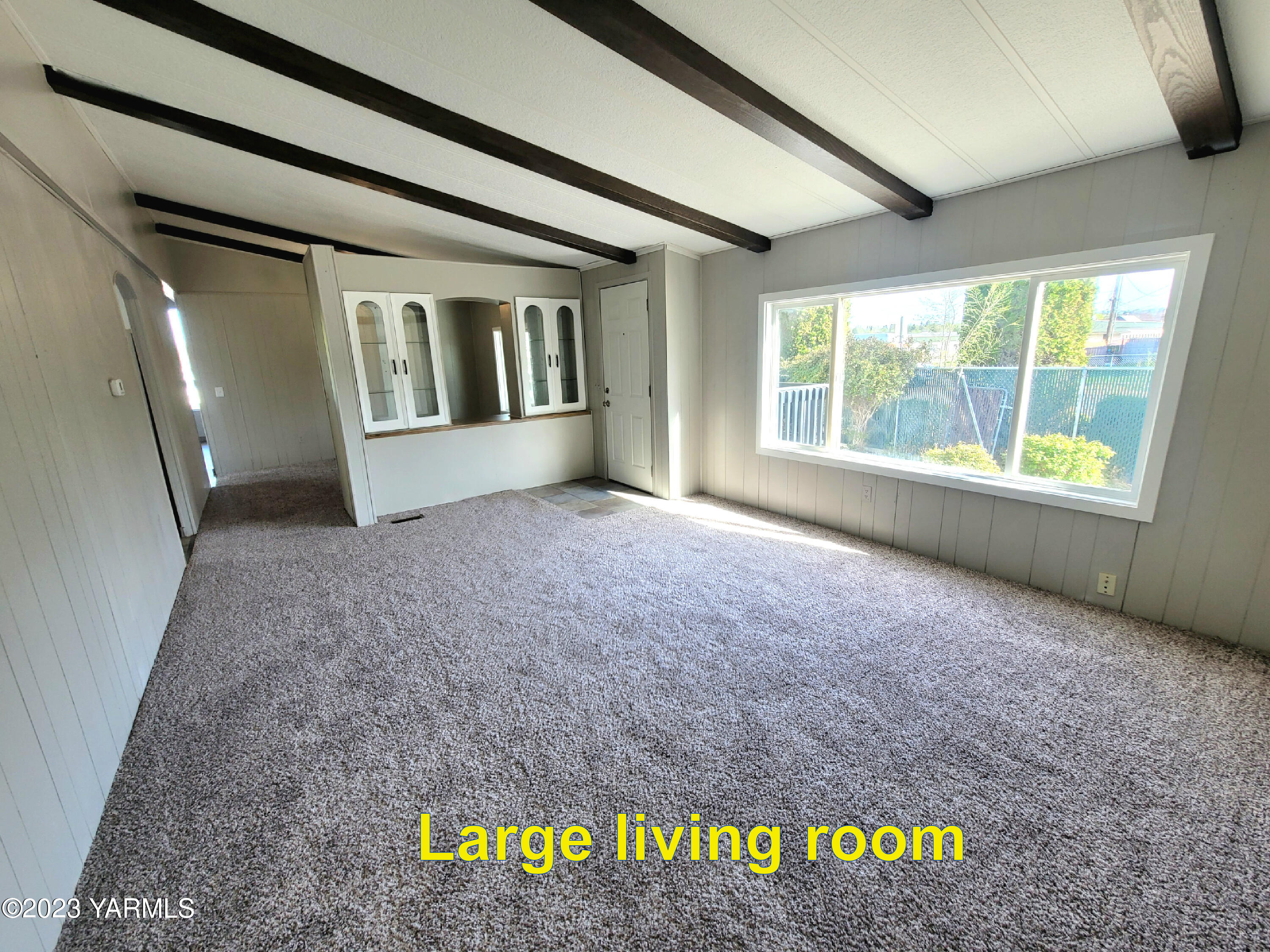 3005 Castlevale Road, Unit 50 Yakima, WA 98902 - Photo 3 of 16 a view of an empty room with a window