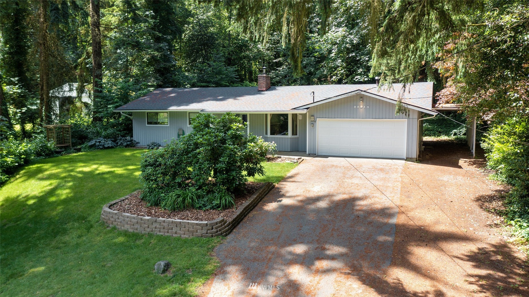 22914 2nd Avenue Southeast Bothell, WA 98021 - Photo 3 of 20 a front view of a house with a yard and garage