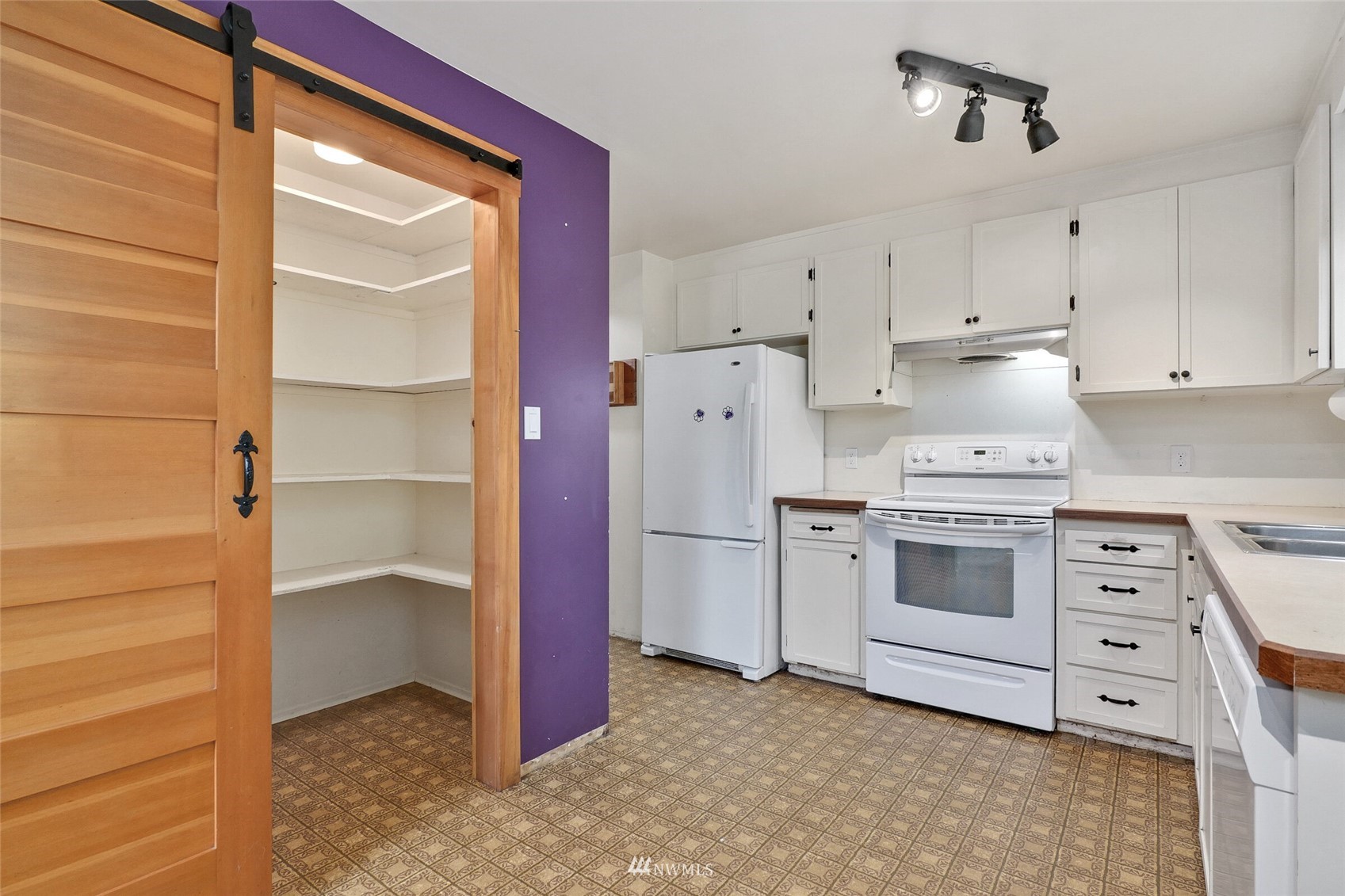 22914 2nd Avenue Southeast Bothell, WA 98021 - Photo 8 of 20 a kitchen with white cabinets and white appliances