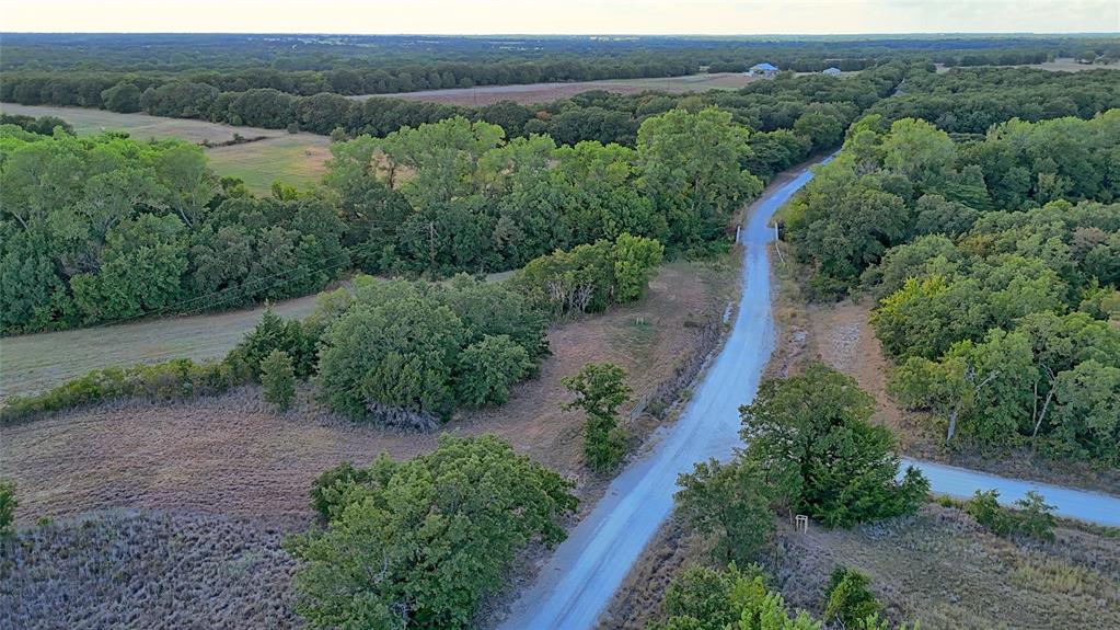 0 Deen Road Bowie, TX 76230 - Photo 13 of 29 an aerial view of green landscape with trees houses and mountain view