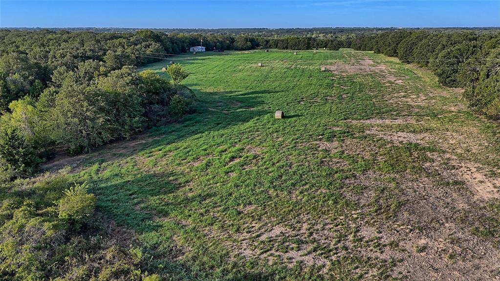 0 Deen Road Bowie, TX 76230 - Photo 18 of 29 a view of a lush green outdoor space with a lake view
