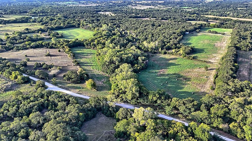 0 Deen Road Bowie, TX 76230 - Photo 4 of 29 an aerial view of residential houses with outdoor space and trees