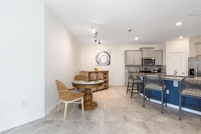 a view of kitchen with cabinets and wooden floor