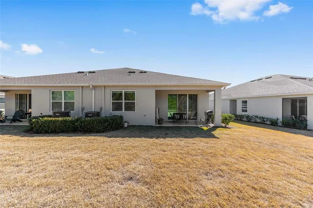 a front view of a house with a yard and porch