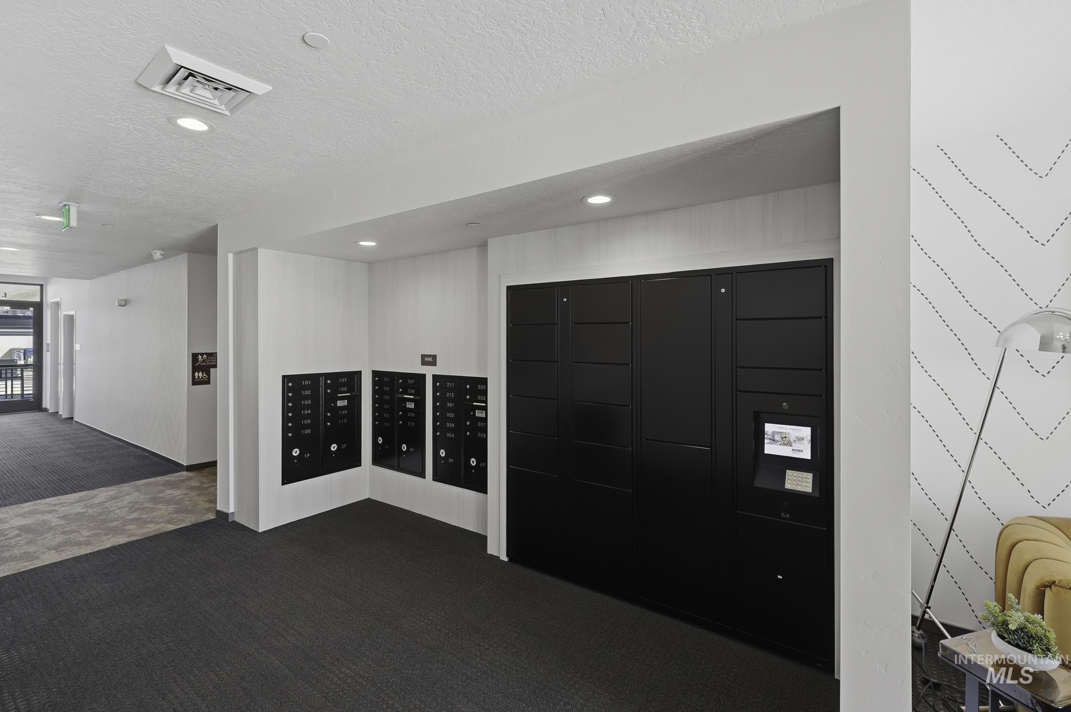 4250 East Haystack Street, Unit 308 Boise, ID 83716 - Photo 26 of 27 View of home's community with mail area and a textured ceiling