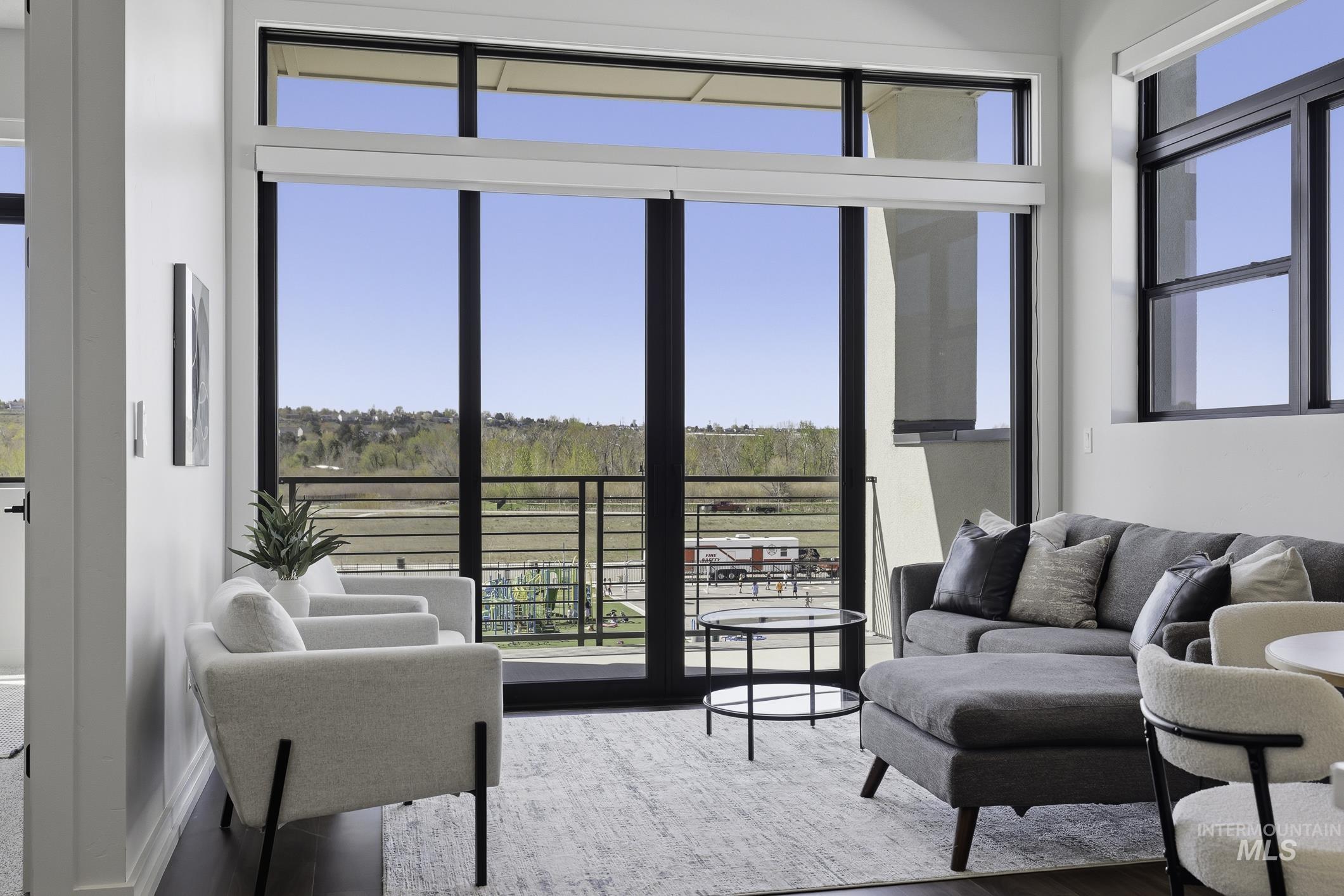 4250 East Haystack Street, Unit 308 Boise, ID 83716 - Photo 5 of 27 Living area with wood finished floors