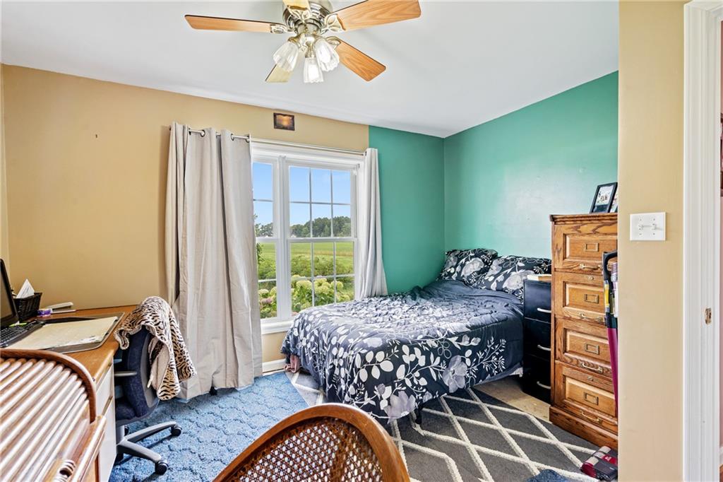 328 Lyons Road Stoneboro, PA 16153 - Photo 15 of 25 a bedroom with a bed and wooden floor