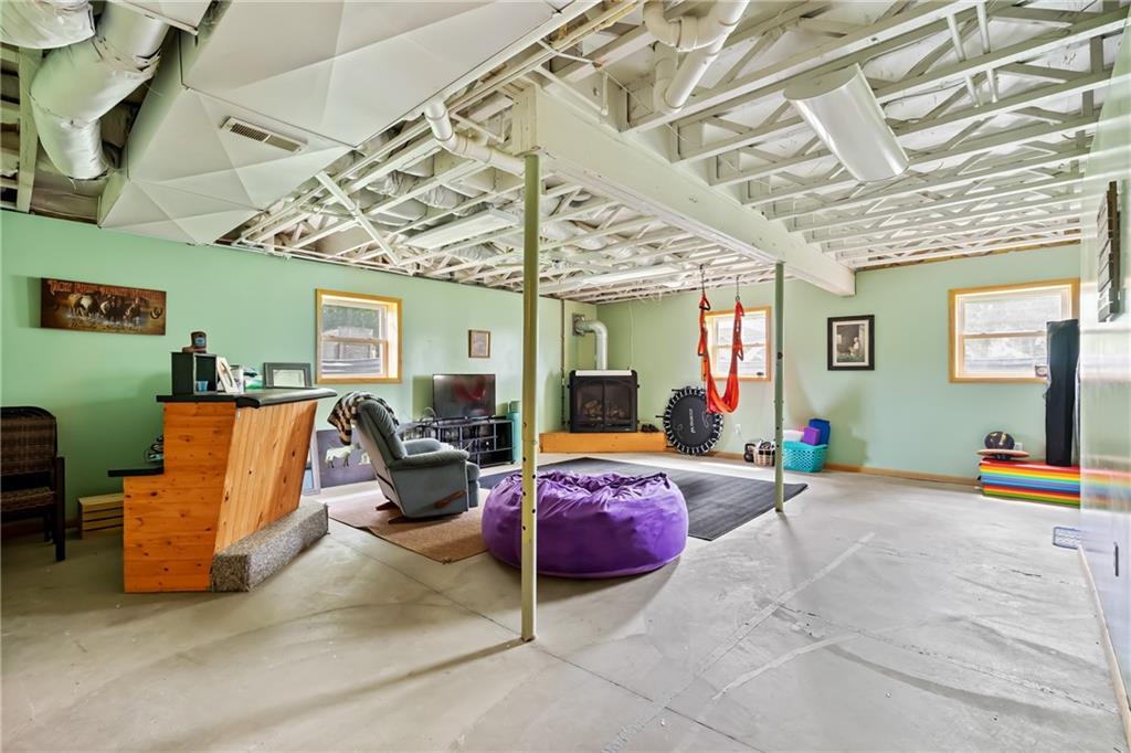 328 Lyons Road Stoneboro, PA 16153 - Photo 17 of 25 a bedroom with furniture and a chandelier