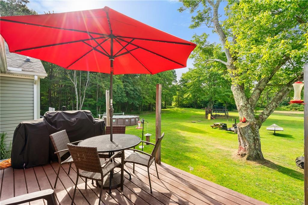 328 Lyons Road Stoneboro, PA 16153 - Photo 18 of 25 a view of a chair and table on the deck