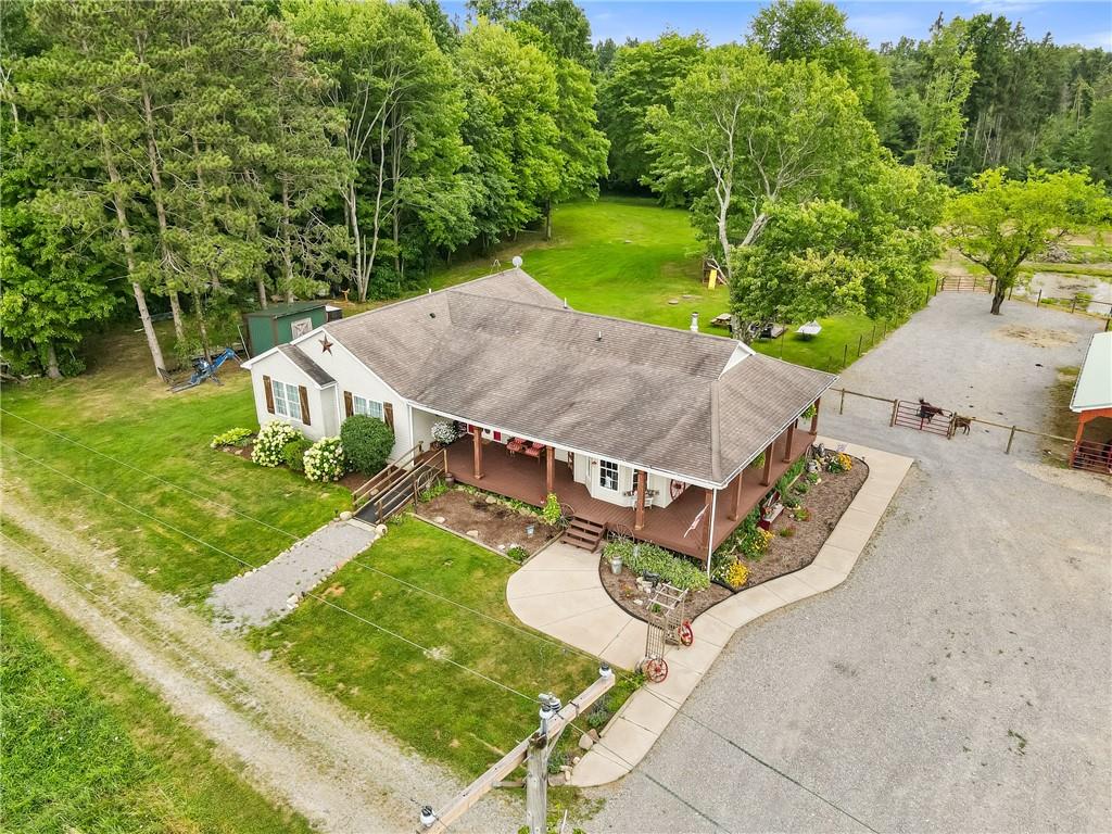 328 Lyons Road Stoneboro, PA 16153 - Photo 23 of 25 an aerial view of a house with garden space and street view