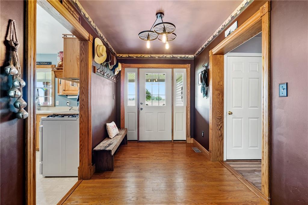 328 Lyons Road Stoneboro, PA 16153 - Photo 5 of 25 a view of an entryway with wooden floor and a livingroom