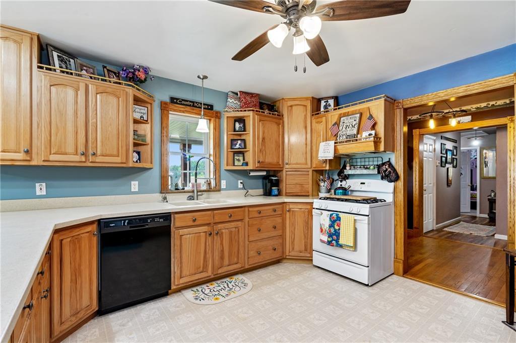 328 Lyons Road Stoneboro, PA 16153 - Photo 6 of 25 a kitchen with stainless steel appliances granite countertop a stove and a sink