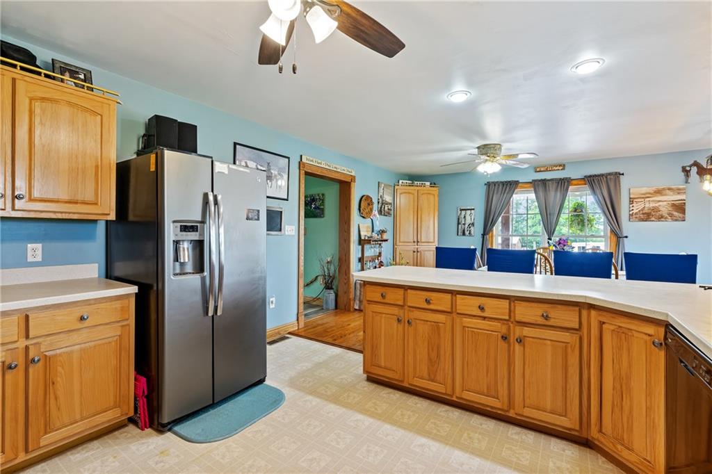 328 Lyons Road Stoneboro, PA 16153 - Photo 7 of 25 a large kitchen with stainless steel appliances granite countertop a refrigerator and a sink