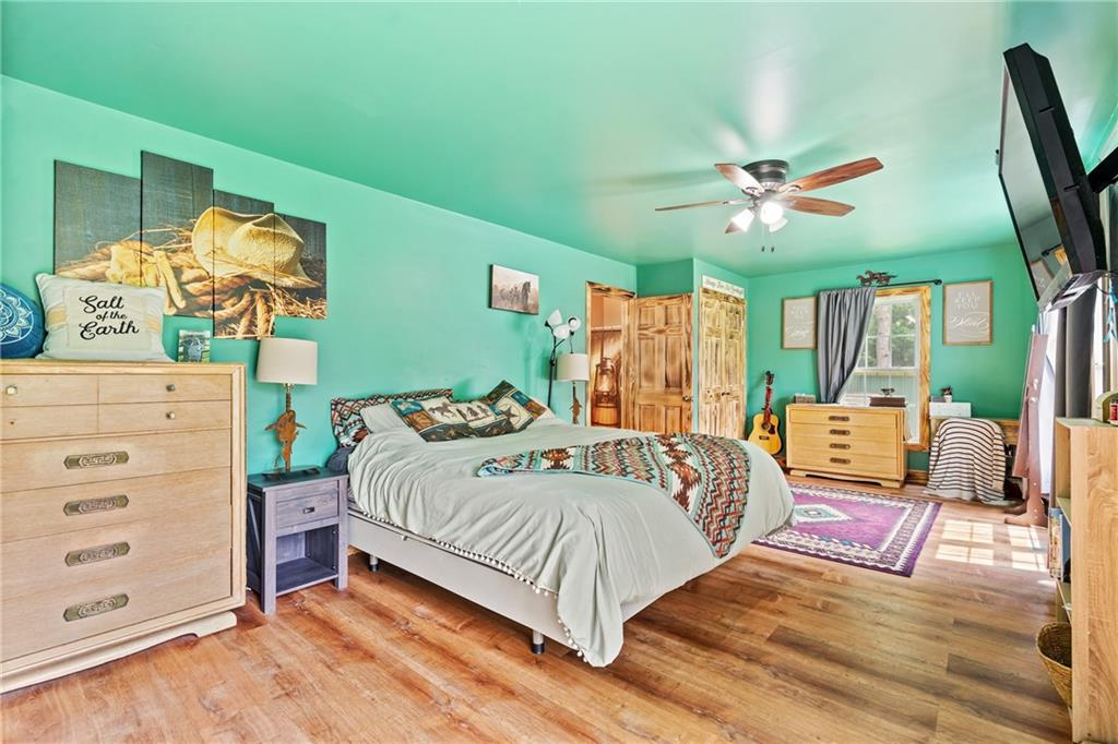 328 Lyons Road Stoneboro, PA 16153 - Photo 10 of 25 a bedroom with a bed a dresser and a flat tv screen