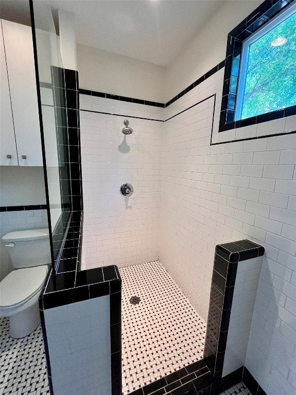 2209 East 18th Street, Unit A Austin, TX 78702 - Photo 11 of 35 Classic meets modern with subway tile, basketweave accents, and tasteful fixtures throughout.