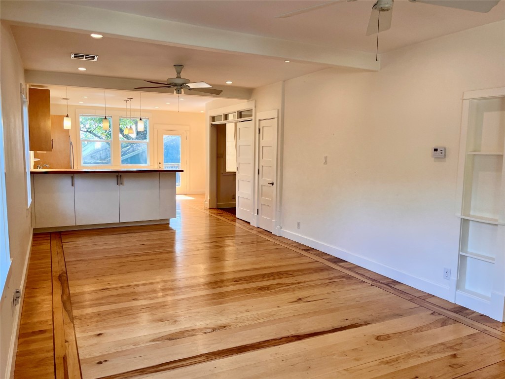2209 East 18th Street, Unit A Austin, TX 78702 - Photo 3 of 35 Pecan hardwood with rich mahogany inlays adorns the main areas.