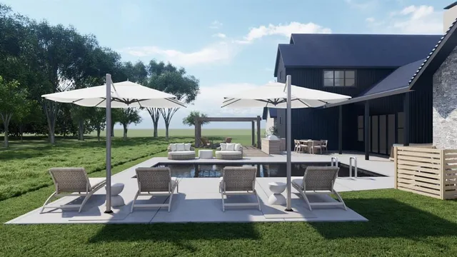 a view of a patio with table and chairs under an umbrella
