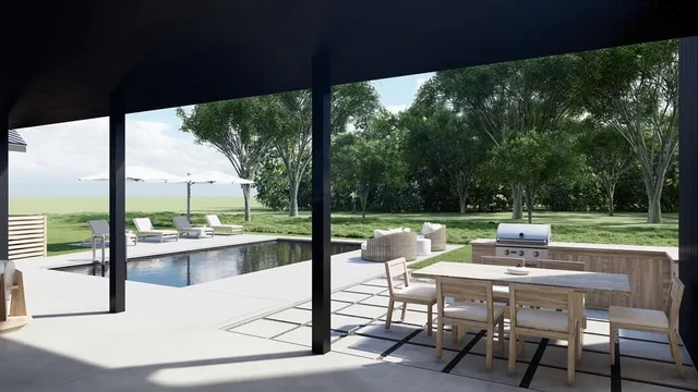 a view of a patio with a table chairs and a backyard